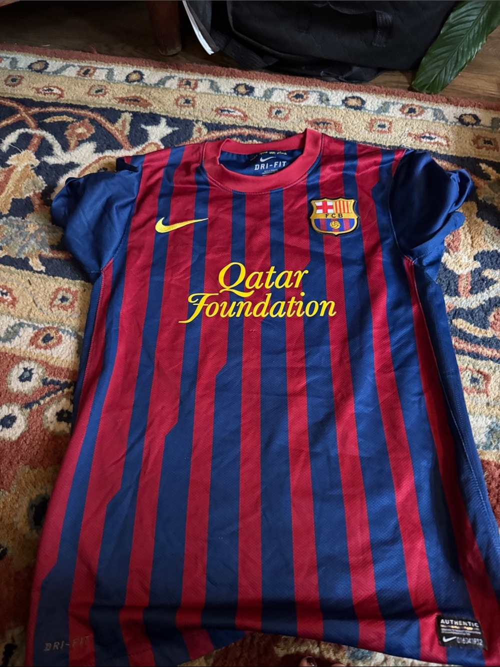 Nike men’s  FC Barcelona Red & Blue Striped Jersey with Yellow Accents